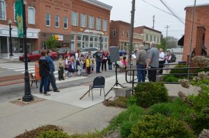 Photograph of a speech given on the sidewalk